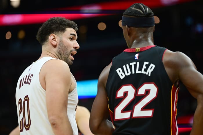 Nov 22, 2023; Cleveland, Ohio, USA; Cleveland Cavaliers forward Georges Niang (20) talks to Miami Heat forward Jimmy Butler (22) during the second half at Rocket Mortgage FieldHouse.